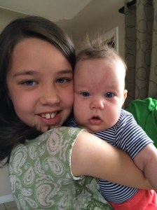 Katherine being loved up on my her big sister.