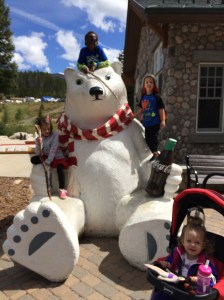 Kids by the giant Coca-Cola bear.
