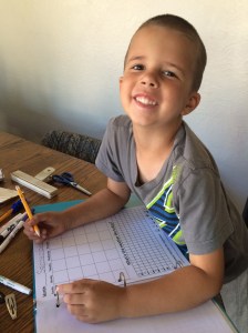 Jonathan is working on his daily notebook.