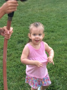 Katherine playing with the hose and getting soaking wet. June 2016